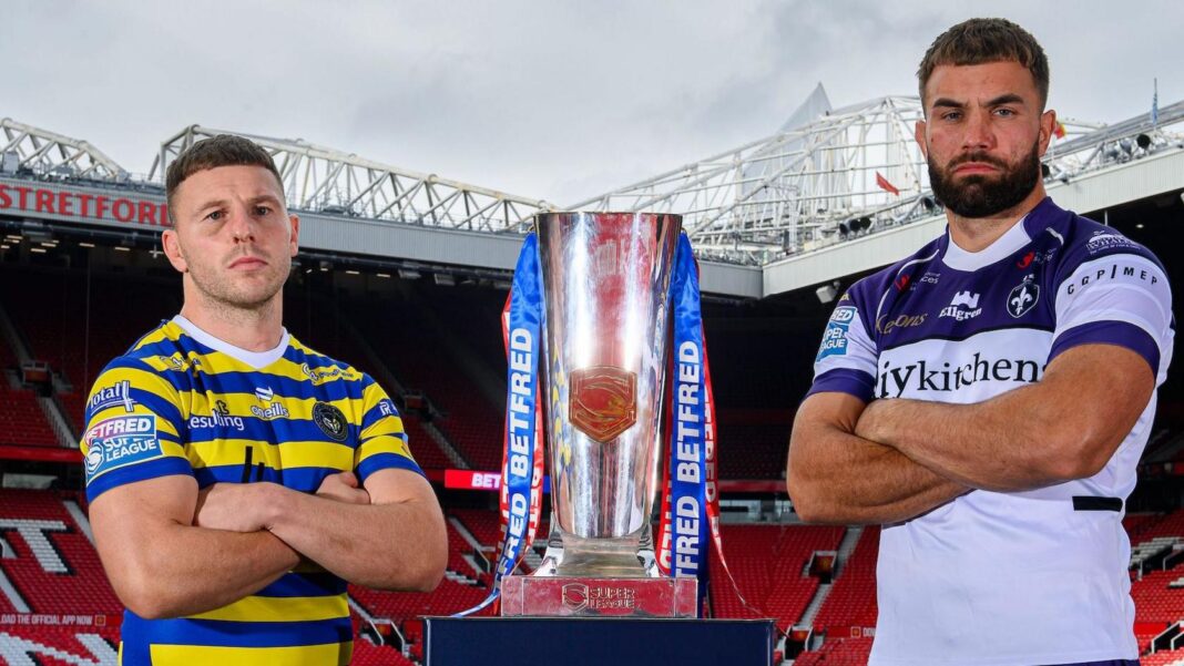 Warrington Wolves' George Williams and Wakefield Trinity's Mike McMeeken stand alongside the Super League trophy at Manchester United's Old Trafford