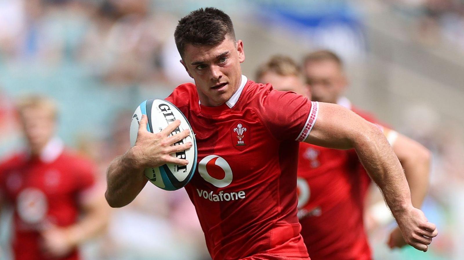 Wales scrum-half Reuben Morgan-Williams runs in for a try