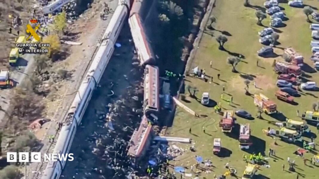 Overturned carriages and makeshift medical tents at crash site image