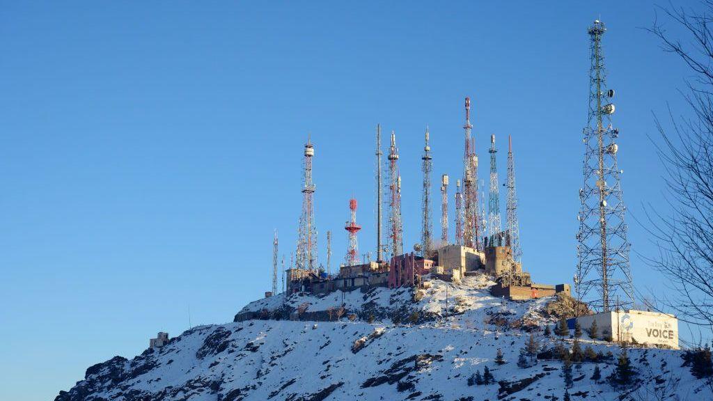 Telecommunication masts and antennas stand over the Koh-e Asamai, a mountain known as TV Hill, in Kabul