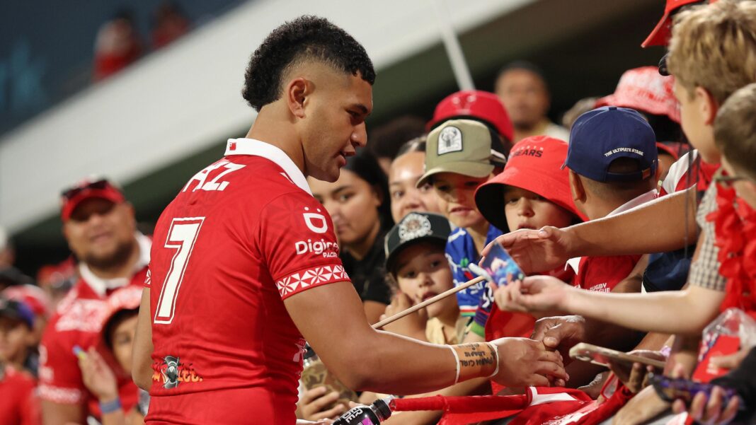 England stunned by Tonga in World Cup opener Isaiya Katoa meets Tonga fans in the stand after the match