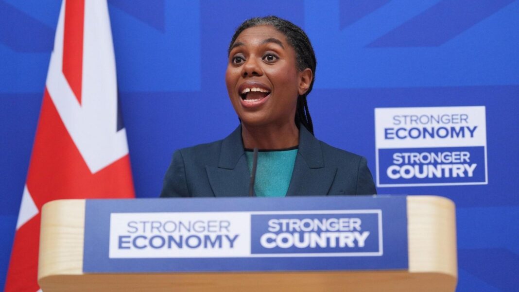 Tories aim to be election-ready ahead of party conference Kemi Badenoch makes a speech at a lectern bearing the slogan 'Stronger Economy, Stronger Country'. She is wearing a dark jacket and green top, and behind her is a union jack flag.
