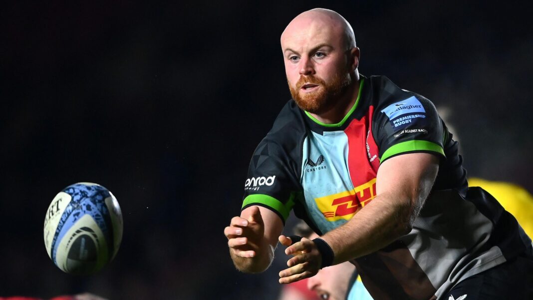 James Chisholm throws a pass while playing for Harlequins