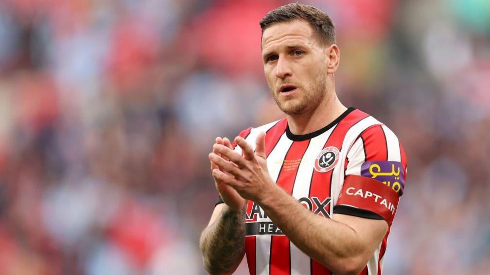 Billy Sharp applauds the Sheffield United fans after a game against Manchester City in 2023