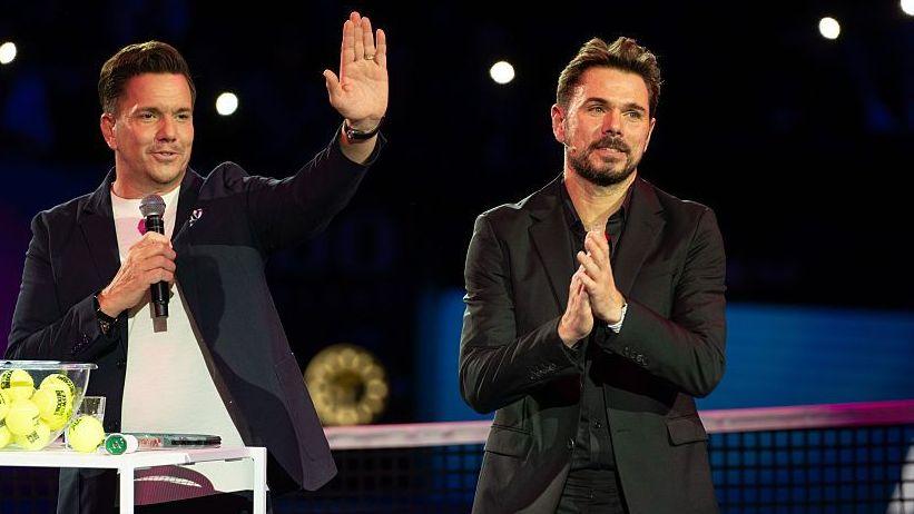 Stan Wawrinka, in a dark jacket, applauds as he is feted in Basel