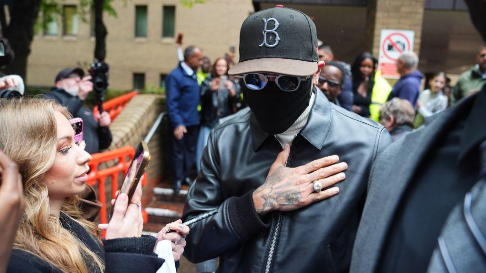 R&B singer Chris Brown meets fans as he leaves Southwark Crown Court, south London, after being given an eight-month suspended prison sentence after he pleaded guilty to affray following a bottle attack on Abraham Diaw in February 2023. Picture date: Monday October 26, 2026.