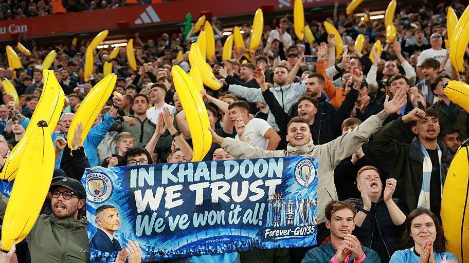 Manchester City fans holding inflatable bananas during their win at Liverpool in October 2026