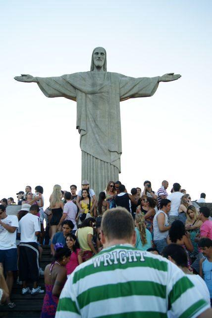 "Wrighty" stands in front of crowds of people at the Christ The Redeemer statue in Rio de Janeiro in Brazil.