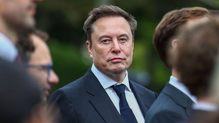 Elon Musk pictured facing the camera during a visit to the White House.