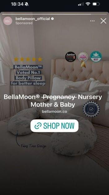A screenshot of an advert on Instagram showing a body pillow on a bed, with text over it reading "Bella Moon Pregnancy Nursery Mother & Baby", with the word "Pregnancy" crossed out.