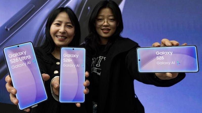 Two women show off Samsung Electronics Co's latest smartphone Galaxy S26 Ultra series at a showcase in Seoul, South Korea, 26 February 2026.
