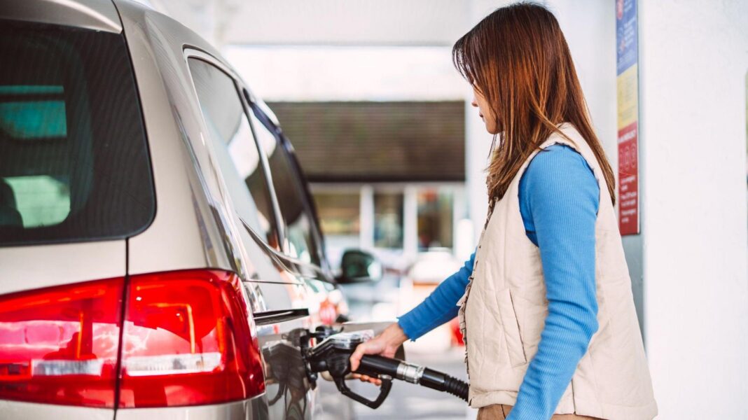 Inflation and government borrowing highest for a year ahead of next week’s Budget Woman fills a car with petrol - stock shot