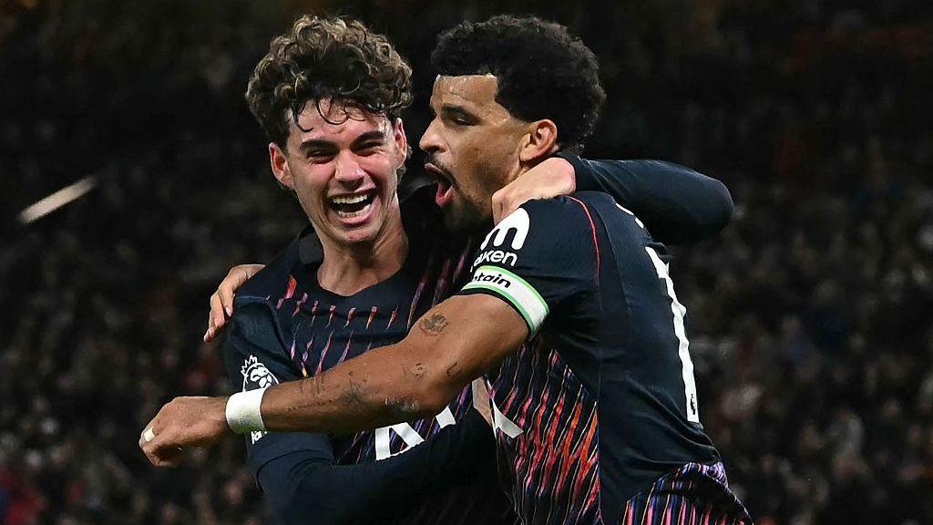 Tottenham Hotspur's English striker #19 Dominic Solanke (R) celebrates with Tottenham Hotspur's English midfielder #14 Archie Gray (L)