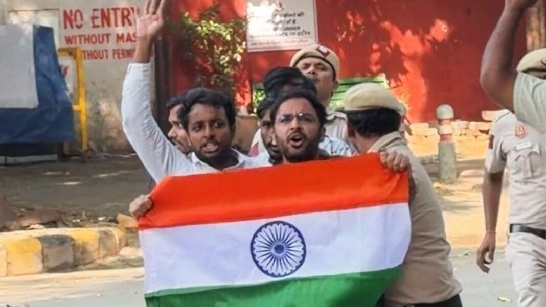 India ‘cockroach’ leaders who called on election chief to quit are freed from jail Ashutosh Ranka seen holding the Indian flag with police dragging him