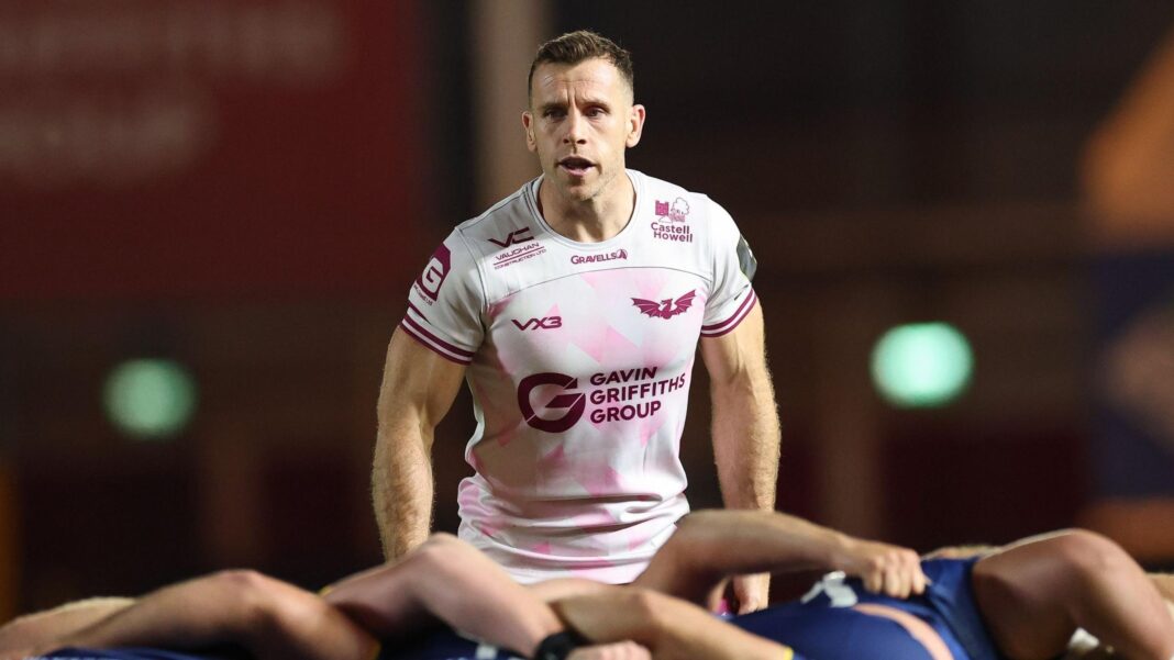 Scarlets' Gareth Davies gets ready to defend from a scrum against Newcastle