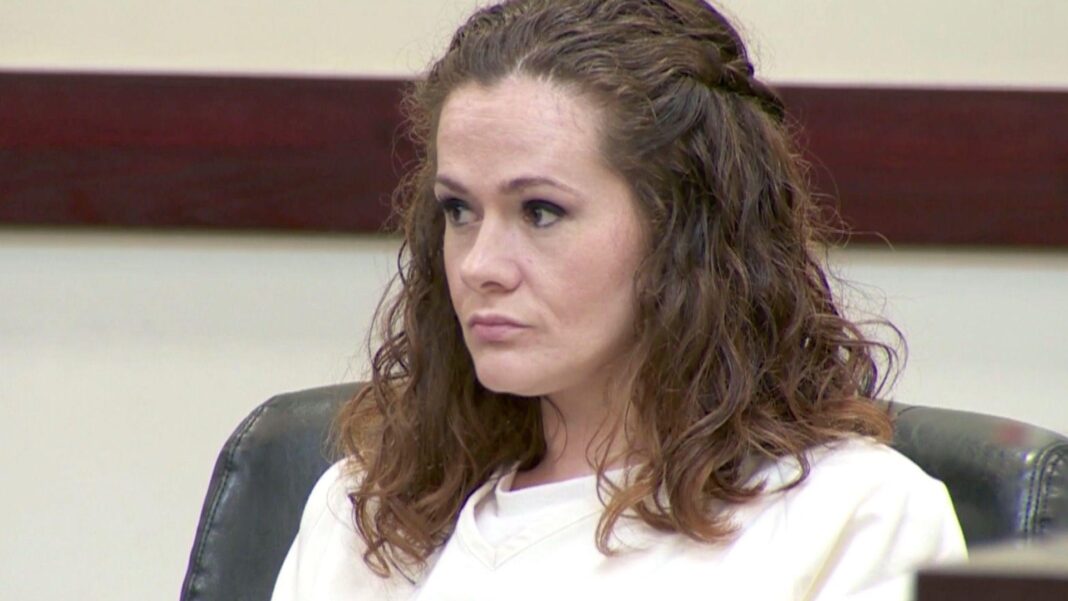 US death row inmate survives execution attempt after two lethal injections A woman in a white prison uniform sits in court.