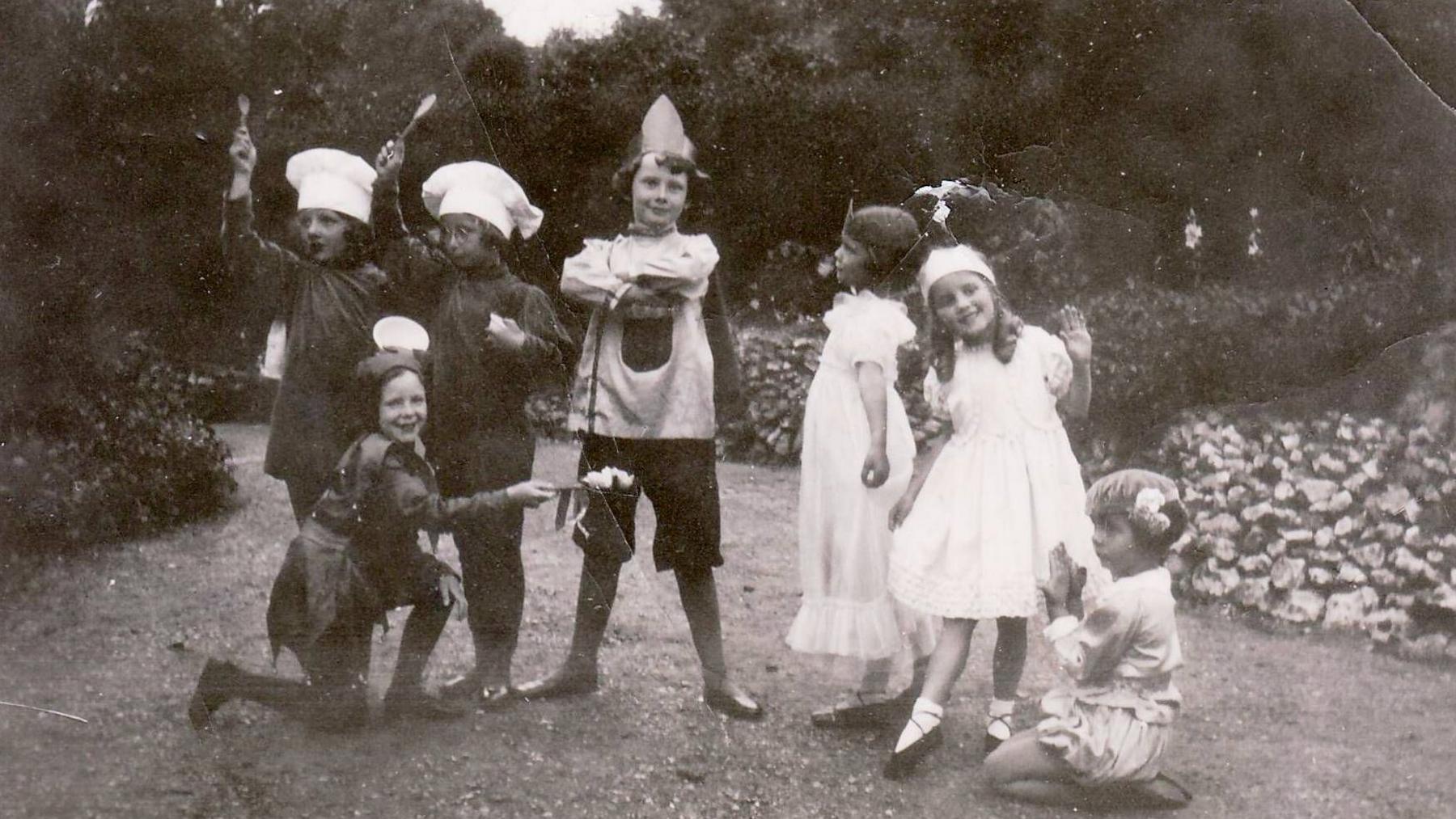 A black and white photograph of Audrey Hepburn with school friends in Elham