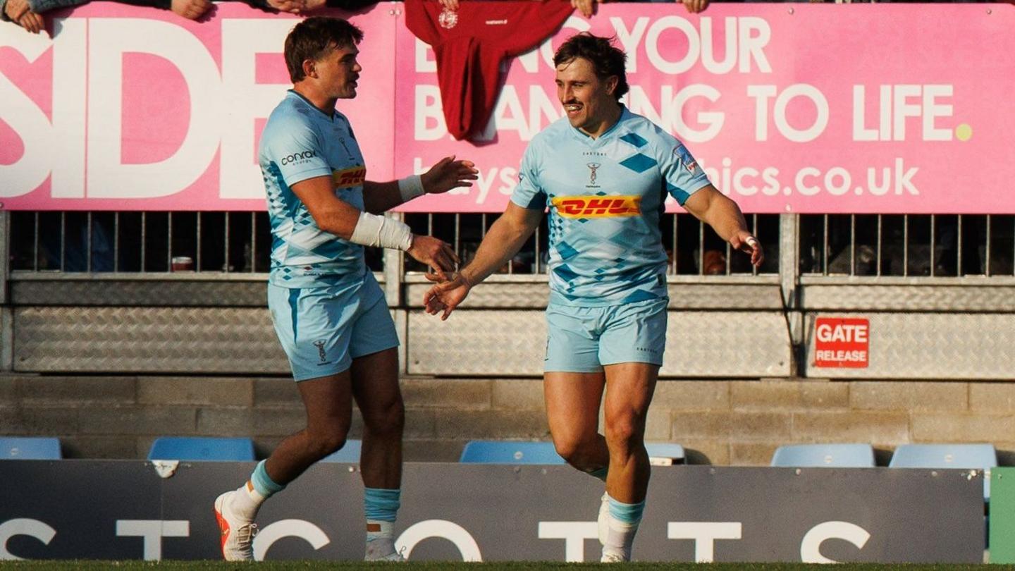 Cadan Murley celebrates scoring the opening try with George Furbank.