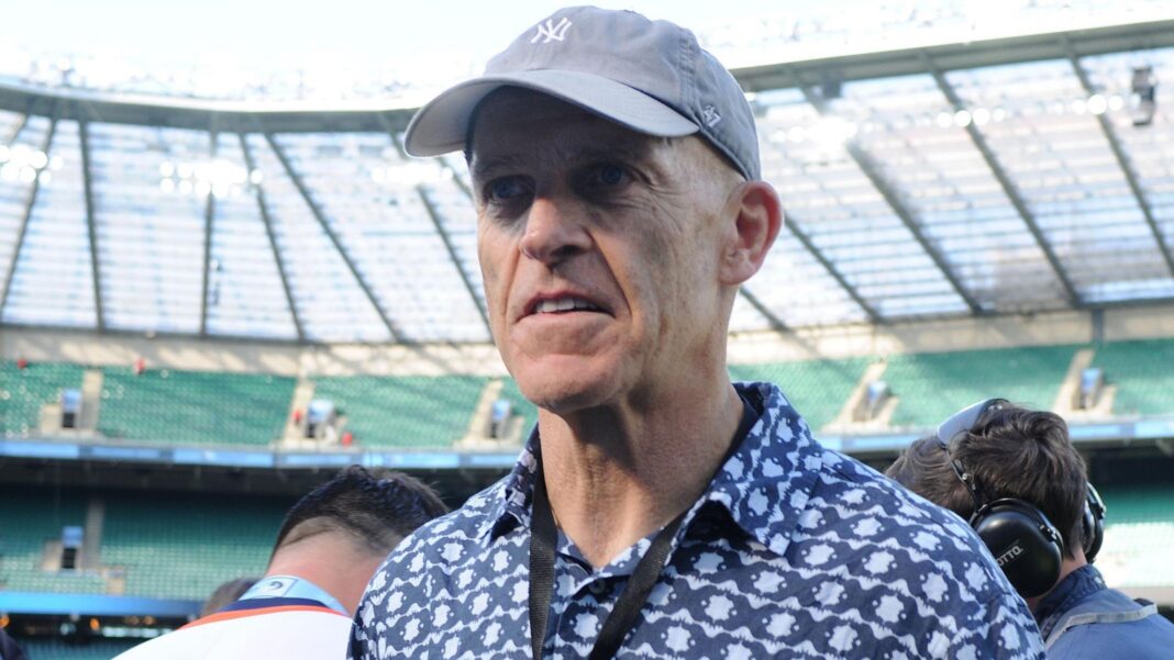 Dominic Silvester in a cap and dark patterned shirt