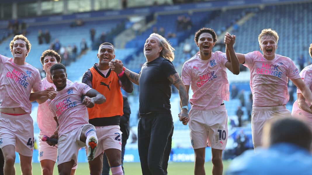 Savage success and statement win for Boro – Sam Parkin’s EFL Takeaways Robbie Savage - in all black - celebrates with his Peterborough players in a pink away kit following their win at Leicester