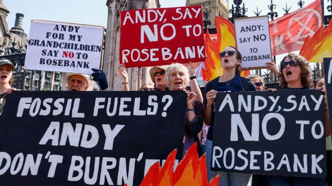 PM warned Rosebank oil field could breach West Bank sanctions Protesters outside Parliament in central London hold placards reading "Andy, say no to Rosebank" and drawings of flames.