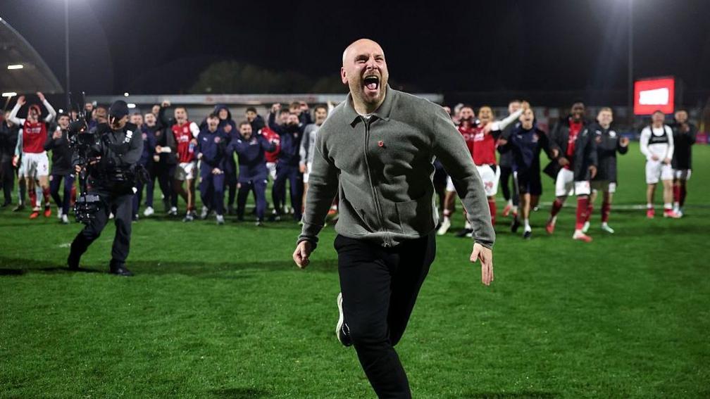 Fleetwood Town boss Matt Lawlor celebrates their win against Arsenal