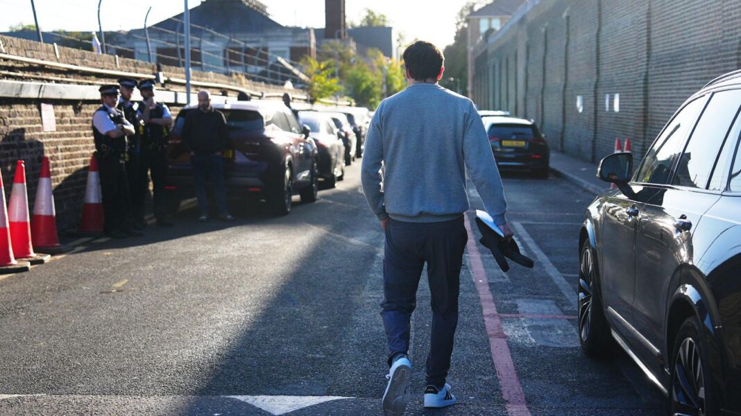 Hundreds of criminals start leaving prison under new early release scheme A man walks down the driveway of Brixton prison in south London.
