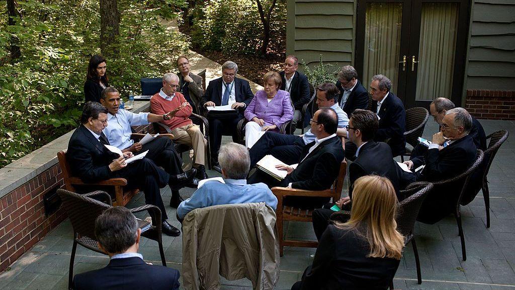 Then-US President Barack Obama meets with Eurozone leaders on the Laurel Cabin patio during the G8 Summit on 19 May 2012 at Camp David, Maryland