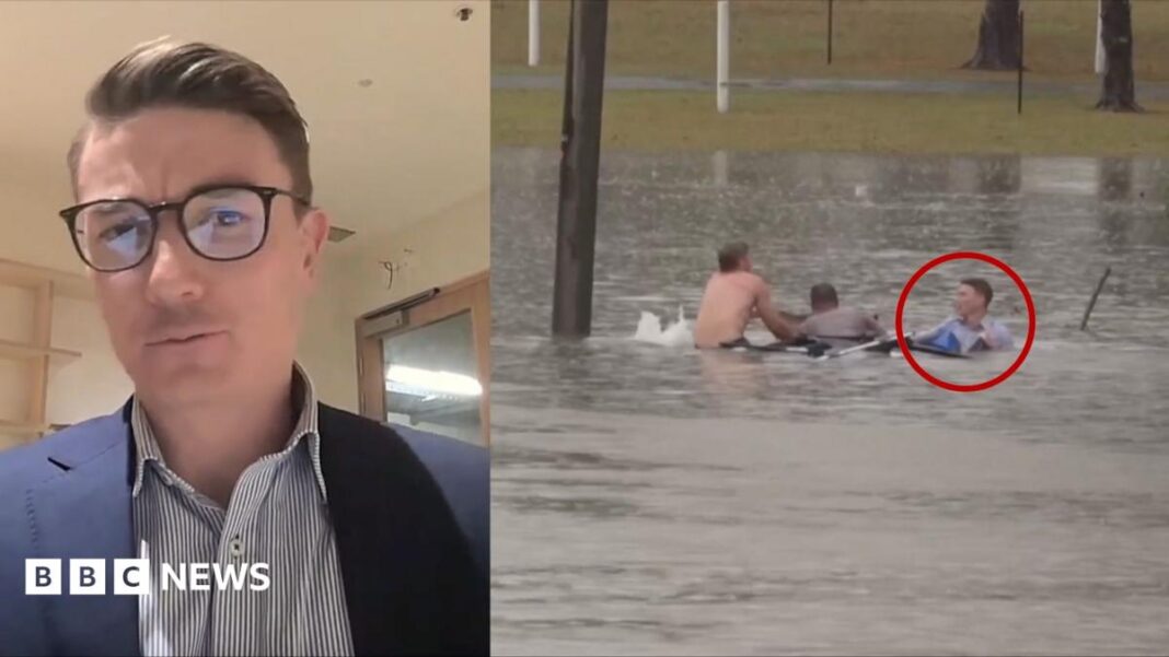 Moment man rescued from sinking car by Australian TV reporter image