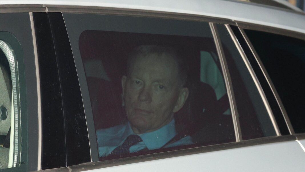 Sir Chris Bryant looking out a car window