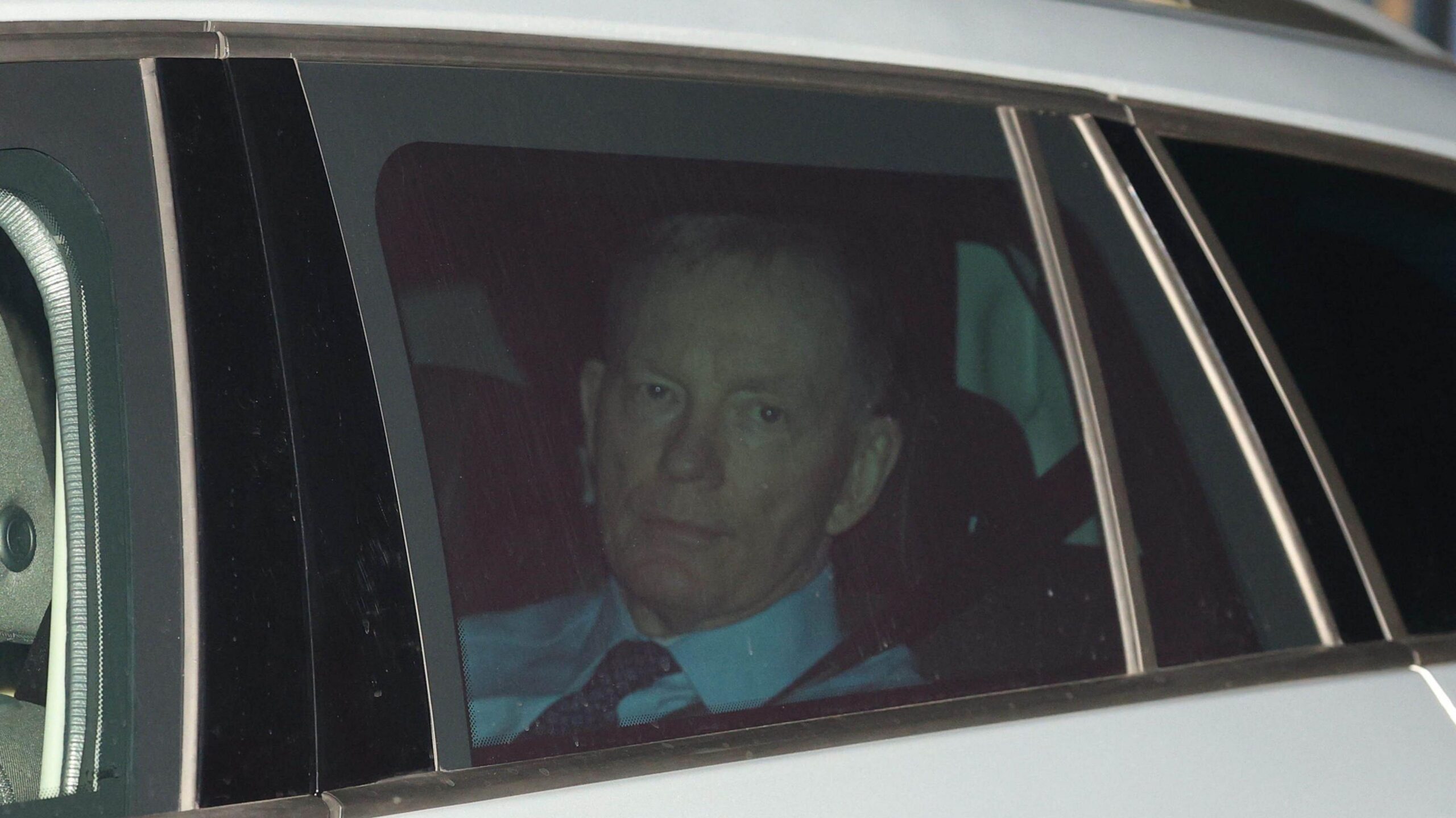 Sir Chris Bryant looking out a car window