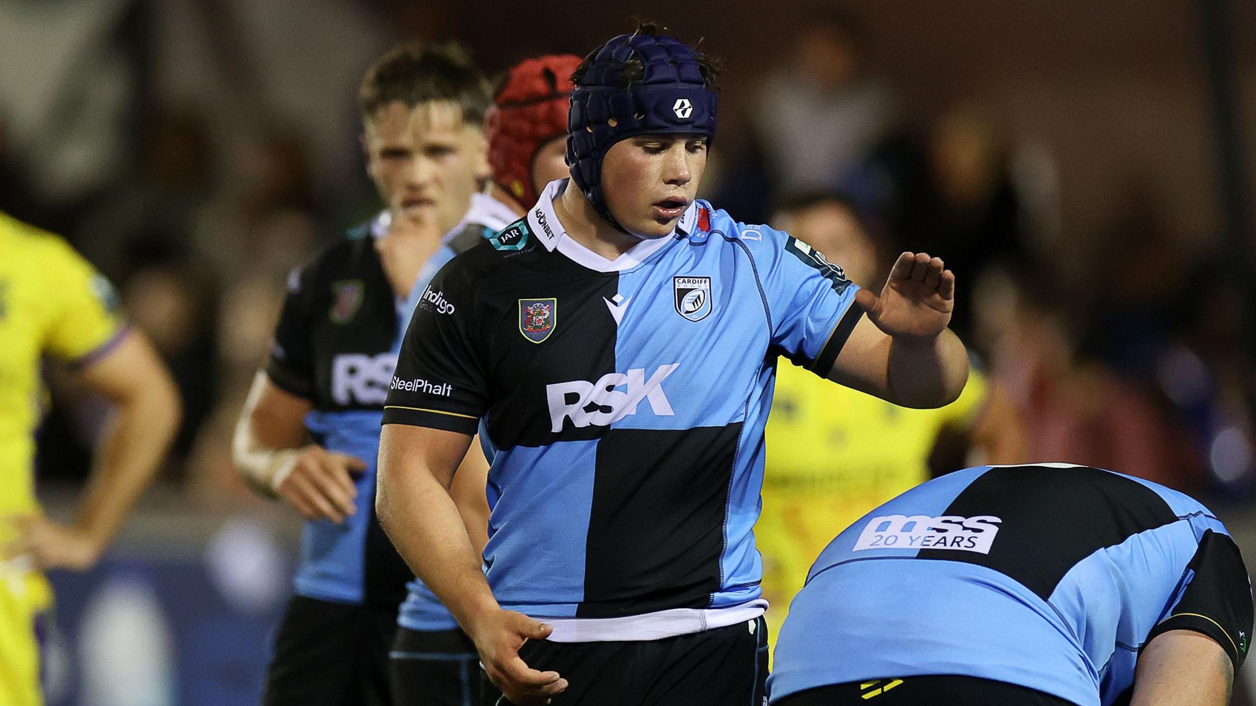 Tom Howe slaps a Cardiff team-mate on his back