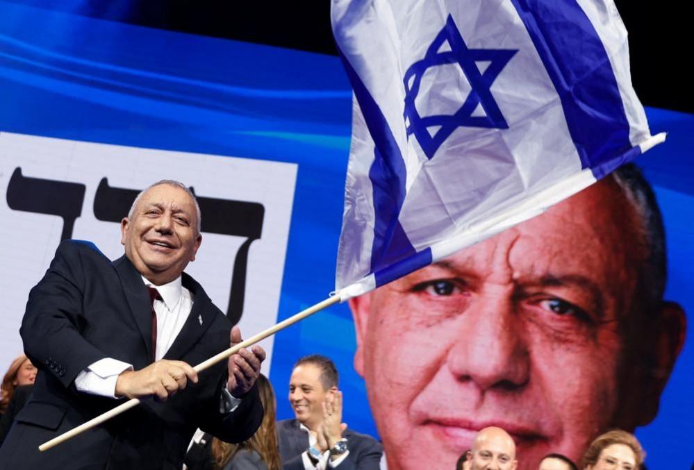 Eisenkot waves an Israeli flag.