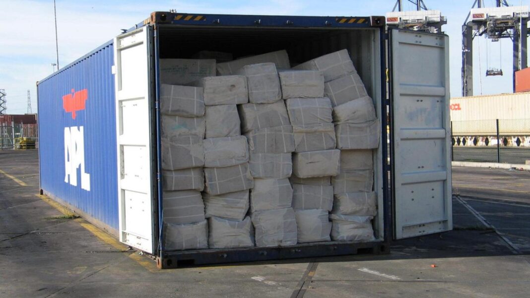 The convicted £33m tax fraudster living it up in Dubai A container ship container packed full of bundles of counterfeit clothes sits on a dockside, with its door wide open.