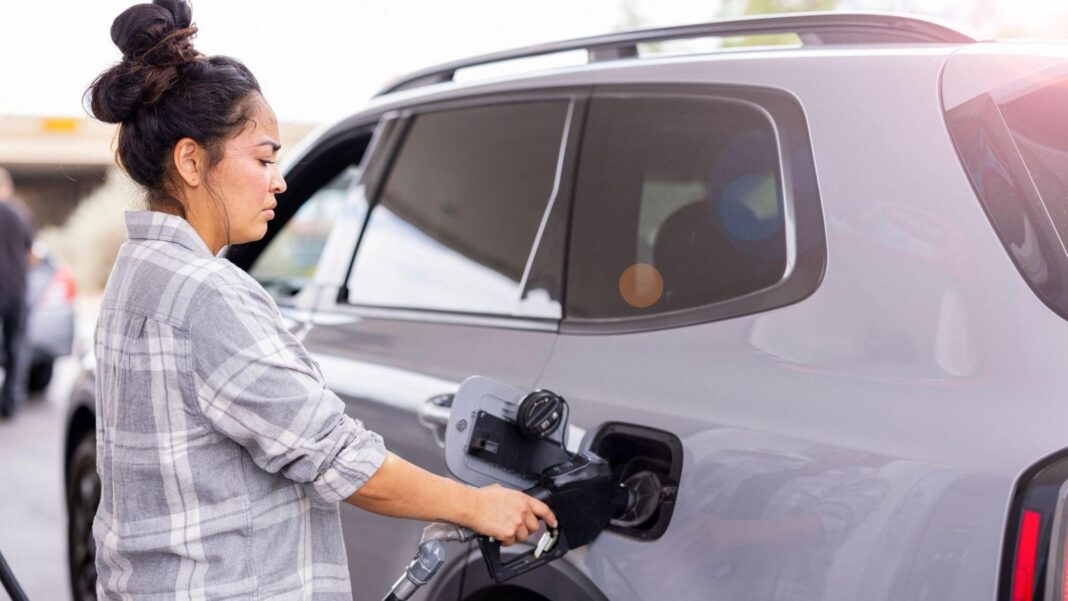 US inflation rises more than expected ahead of midterm elections Woman fills up her car with fuel at forecourt