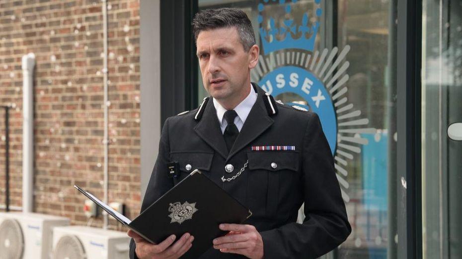 The Deputy Chief Constable for Sussex Police giving a press briefing.