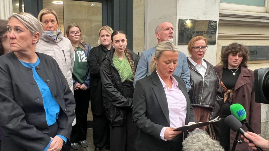 Student who stabbed housemate 30 times admits murder Det Ch Insp Edgeworth wearing a dark suit and pale pink shirt, reading from a statement outside court, surrounded by Jamie Collins' family.