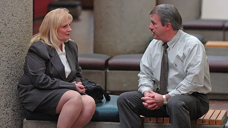 May Martinez, mother of Colleen Slemmer, and a retired Knoxville Police department detective outside a courtroom for a post-conviction hearing in 2006
