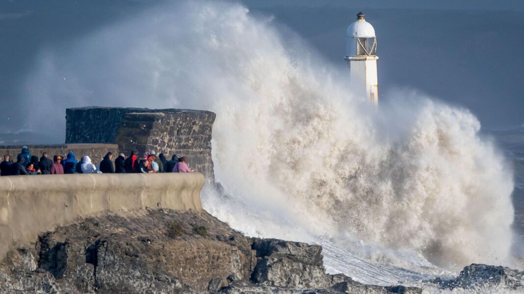 Waves crash against the harbour wall in Porthcawl, Wales