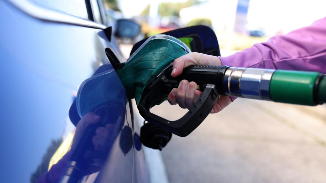Trump waives several Russia sanctions as new US law takes effect A close up shot of petrol being pumped into a blue car