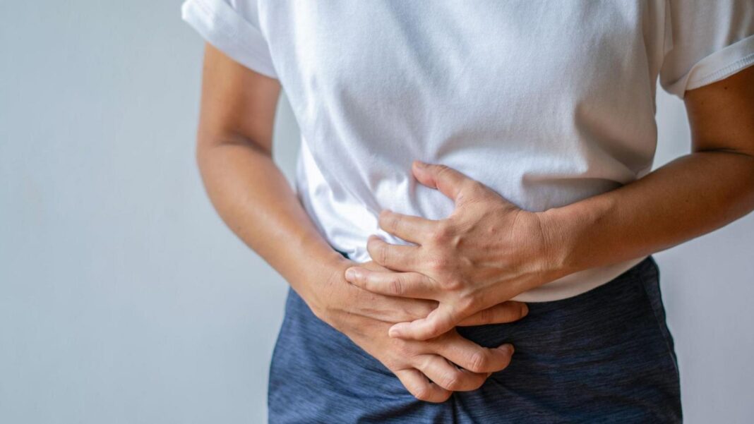 ‘Betrayed by my body’: The taboo health issue women are talking about on social media A young woman holding her lower abdomen, in pain due to cramps or a stomachache.