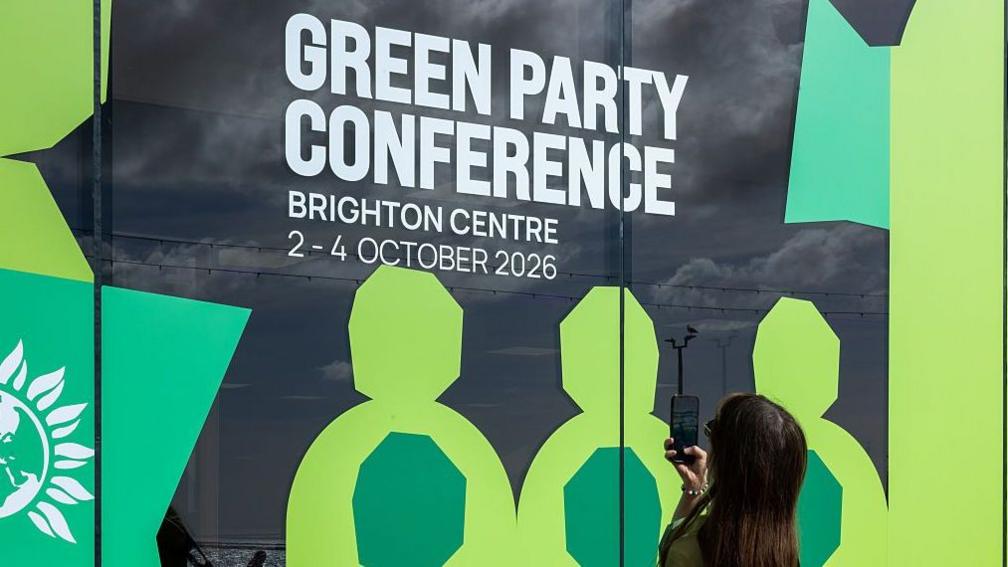A sign advertising the Green Party conference