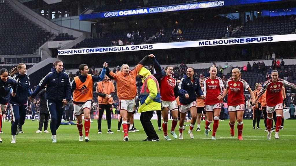 Arsenal celebrate with supporters at full-time