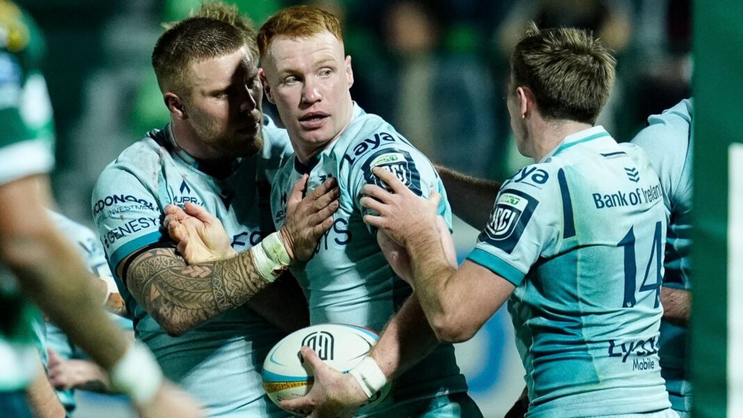Connacht’s Ciaran Frawley celebrates scoring a try with Sean Jansen