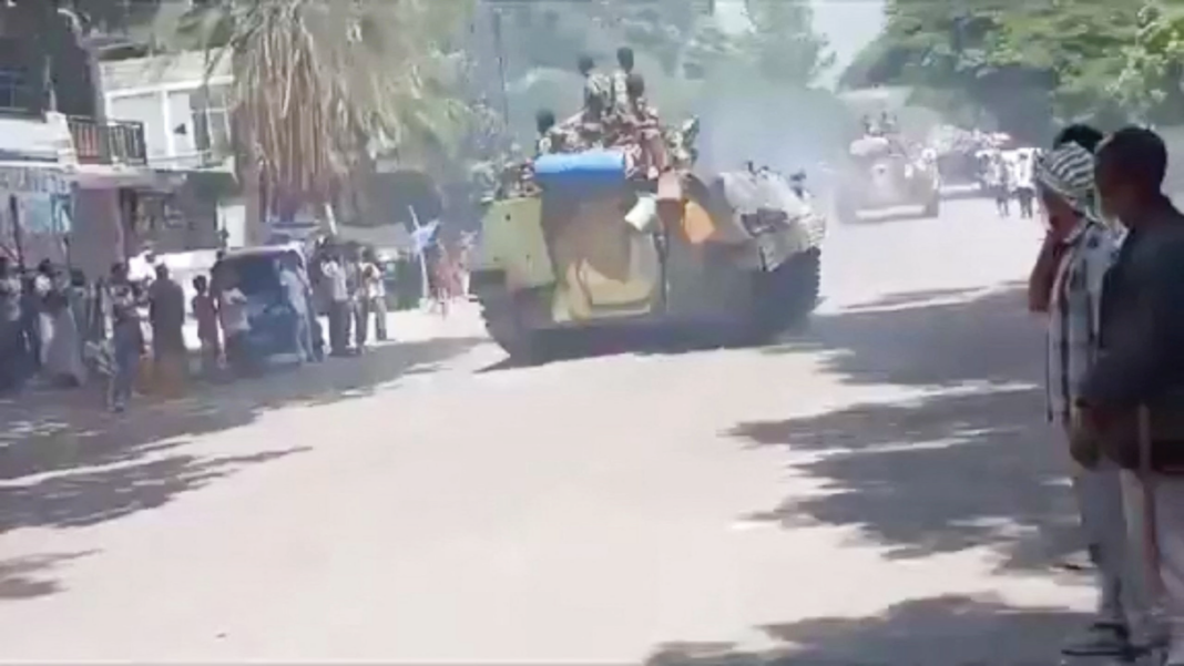 Ethiopian rebel forces withdraw from Tigray regional capital A screengrab showing people looking down a street in Alamata as tanks drive through - 28 September 2026