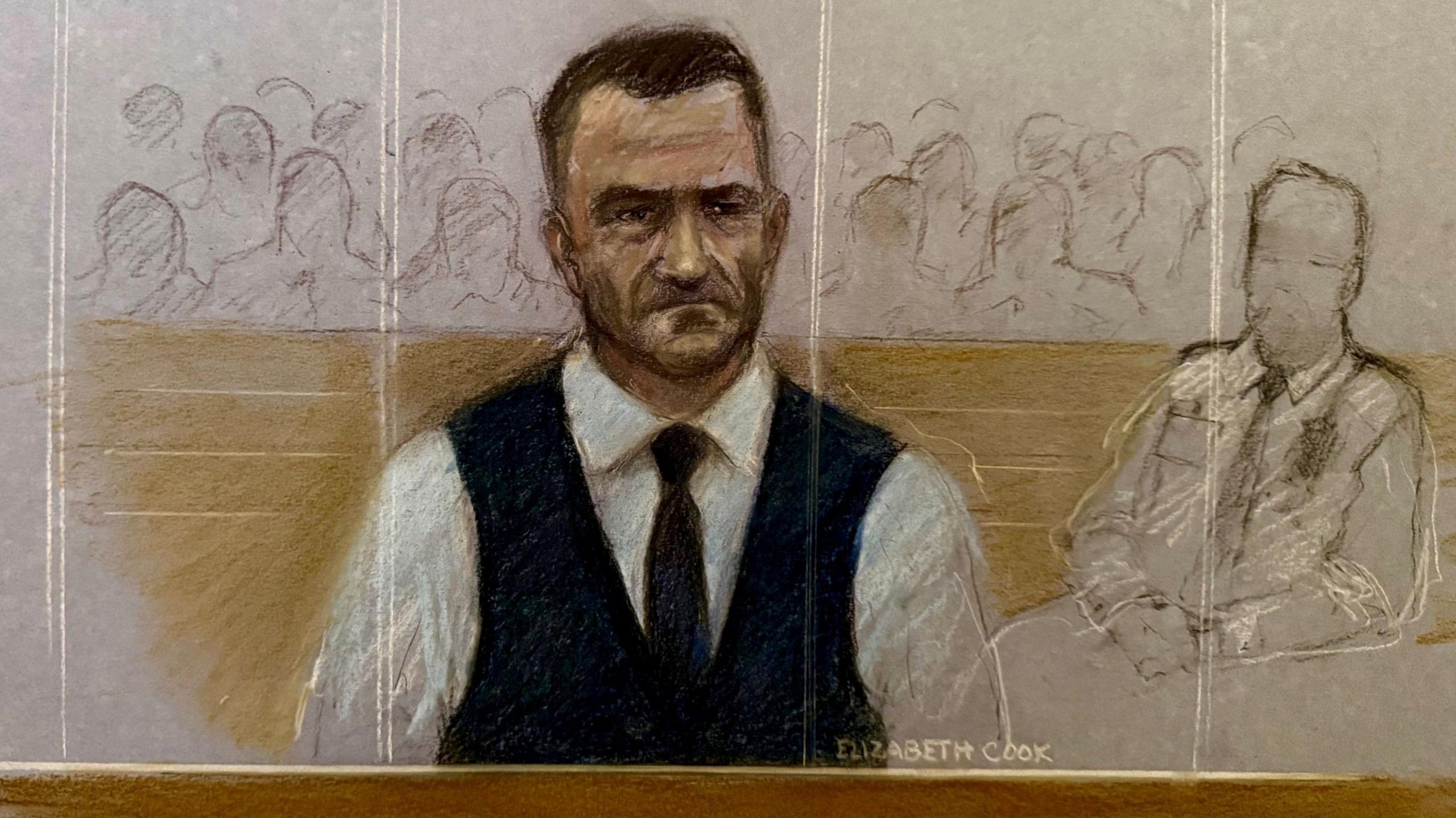 A court sketch of Stephen Yaxley-Lennon sitting in the dock. He wears a white shirt and black waistcoat and tie. To his left is a court official drawn in outline only.