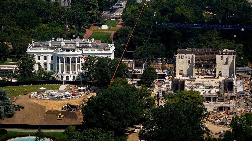 Construction continues on a new helipad on the South Lawn of the White House and the East Wing ballroom on 24 August 2026 in Washington DC.