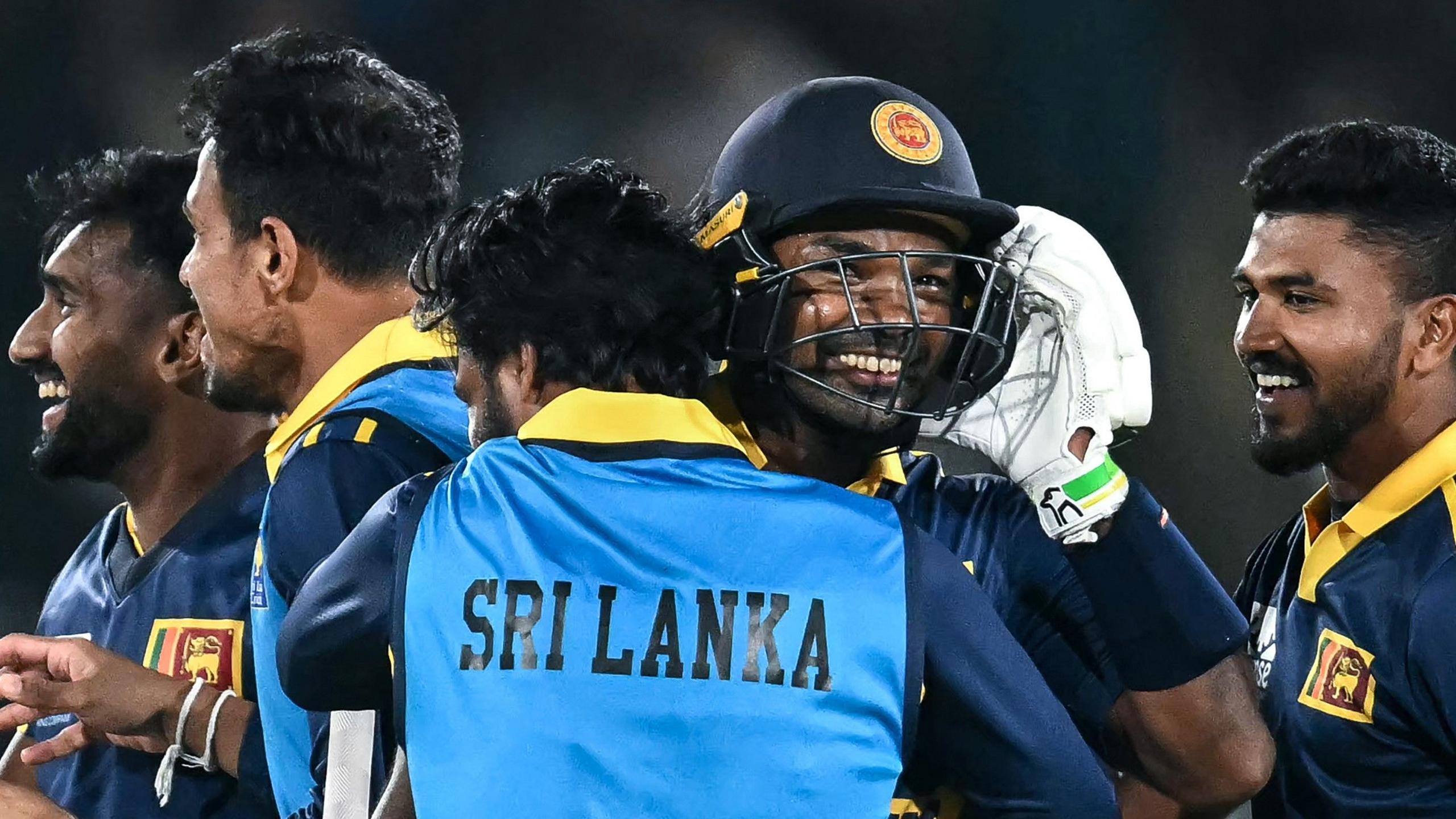 Sri Lanka's players embrace and celebrate their win
