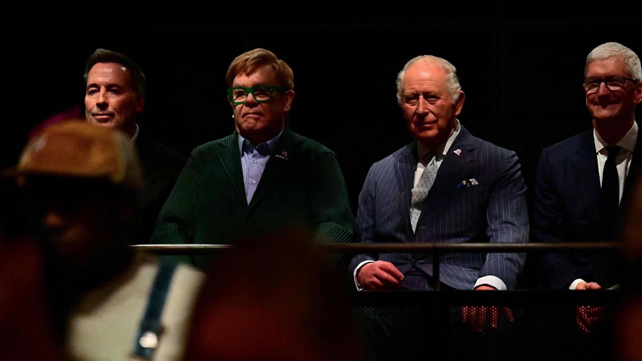 David Furnish, Sir Elton, the King and Tim Cook listening to the performance