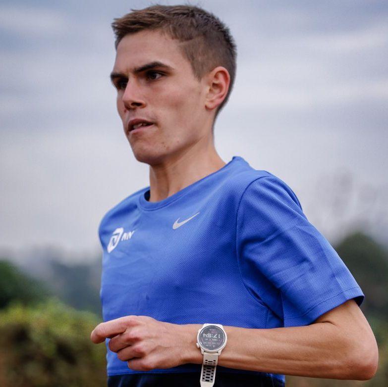 Jake Smith is wearing a blue T-shirt and running